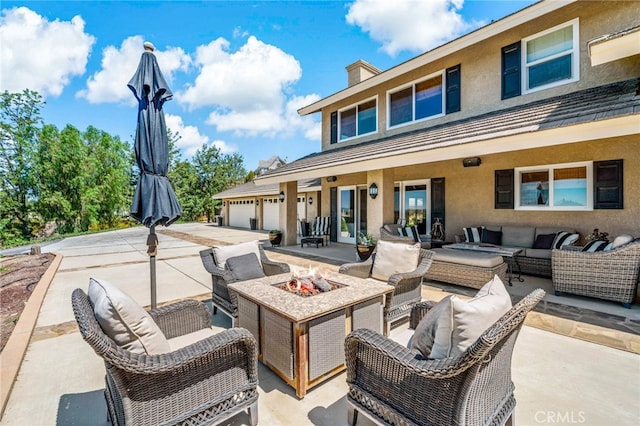 33612 Vino Way, Temecula, CA 92591 - view of patio / terrace featuring an outdoor living space with a fire pit and concrete driveway