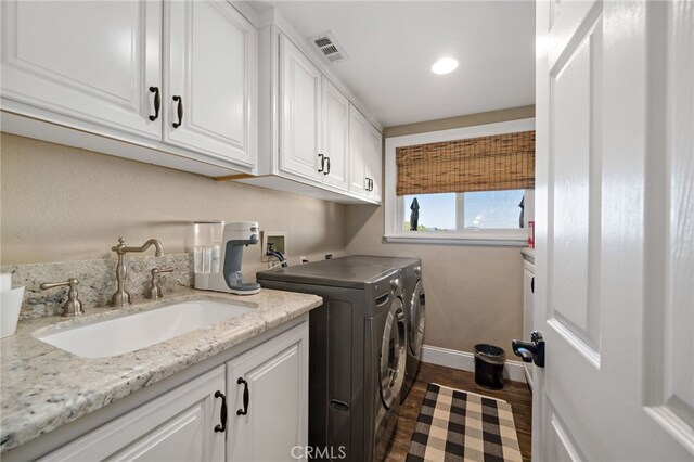 33612 Vino Way, Temecula, CA 92591 - laundry area featuring cabinet space, separate washer and dryer, wood finished floors, and recessed lighting