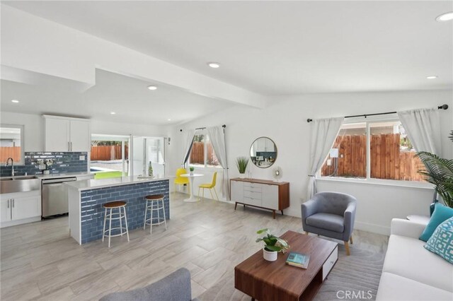 845 W Gateway Dr, Palm Springs, CA 92262 - living area with healthy amount of natural light, recessed lighting, and beam ceiling