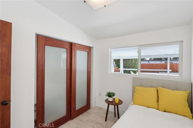 845 W Gateway Dr, Palm Springs, CA 92262 - bedroom with light wood-style floors and lofted ceiling