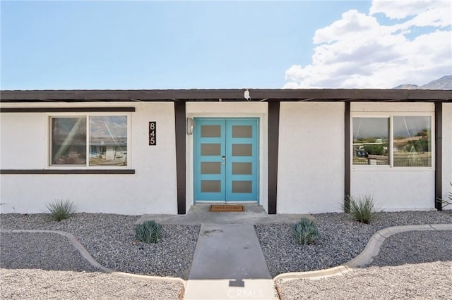845 W Gateway Dr, Palm Springs, CA 92262 - view of exterior entry featuring stucco siding
