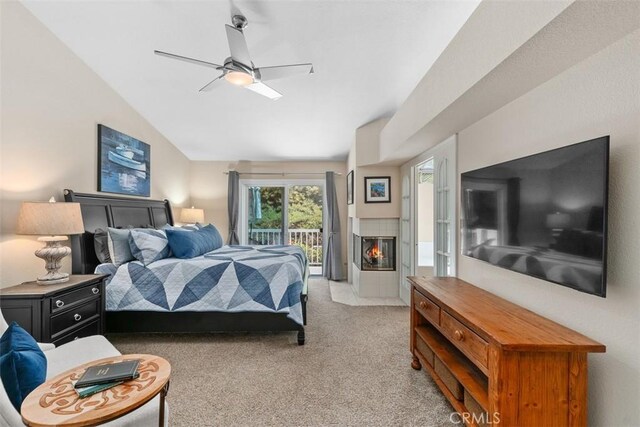 239 Via Presa, San Clemente, CA 92672 - bedroom featuring access to exterior, light carpet, lofted ceiling, ceiling fan, and a tiled fireplace