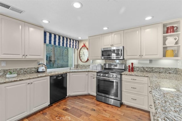 239 Via Presa, San Clemente, CA 92672 - kitchen featuring stainless steel appliances, white cabinetry, light wood finished floors, and recessed lighting