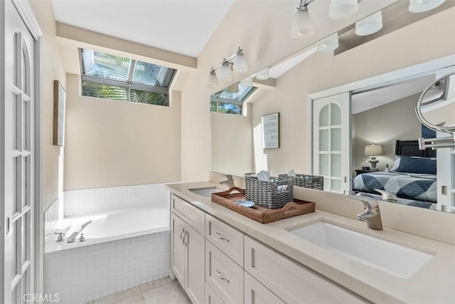 239 Via Presa, San Clemente, CA 92672 - ensuite bathroom with double vanity, a garden tub, and tile patterned floors