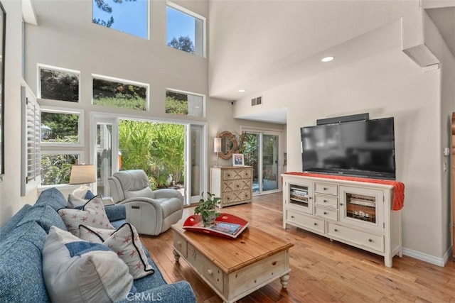 239 Via Presa, San Clemente, CA 92672 - living area with light wood-type flooring, a towering ceiling, and recessed lighting