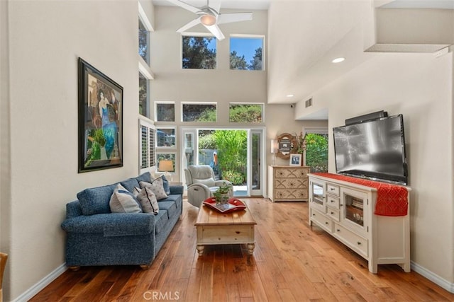 239 Via Presa, San Clemente, CA 92672 - living room featuring wood-type flooring, a towering ceiling, and a ceiling fan