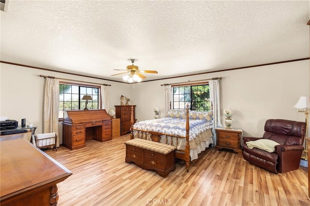 41050 Mesa Robles Cir, Temecula, CA 92592 - bedroom with ornamental molding, light wood finished floors, multiple windows, a textured ceiling, and ceiling fan