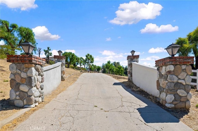 41050 Mesa Robles Cir, Temecula, CA 92592 - view of asphalt driveway with street lights