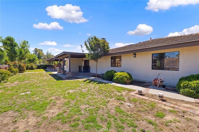 41050 Mesa Robles Cir, Temecula, CA 92592 - back of house with a patio, stucco siding, and a yard