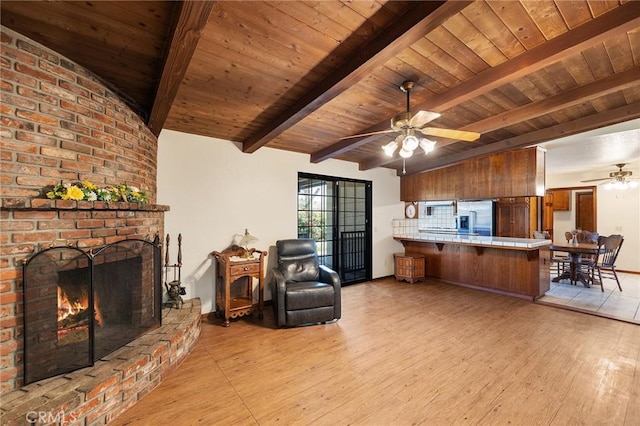 41050 Mesa Robles Cir, Temecula, CA 92592 - living area with ceiling fan, wood ceiling, light wood-style floors, and a brick fireplace