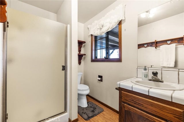 41050 Mesa Robles Cir, Temecula, CA 92592 - bathroom with wood finished floors, vanity, and a stall shower
