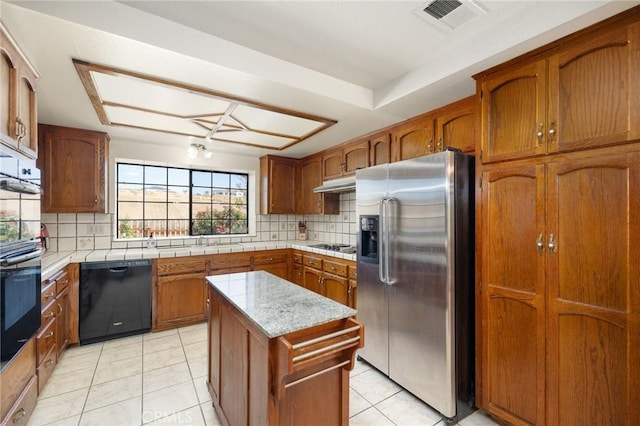 41050 Mesa Robles Cir, Temecula, CA 92592 - kitchen with stainless steel fridge with ice dispenser, black dishwasher, decorative backsplash, brown cabinets, and light tile patterned floors