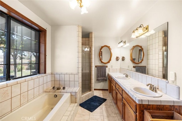 41050 Mesa Robles Cir, Temecula, CA 92592 - full bath featuring double vanity, a bath, tile patterned floors, and a stall shower