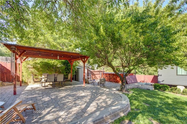 4887 Arizona Ave, Atascadero, CA 93422 - fenced backyard with a pergola, outdoor dining space, a patio area, and a storage unit
