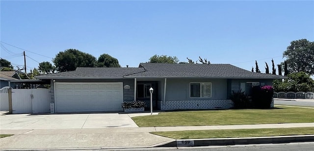 650 S Primrose St, Anaheim, CA 92804 - ranch-style house featuring an attached garage, driveway, and a gate