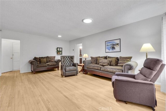 506 Geneva Ave, Claremont, CA 91711 - living room with light wood-style floors, a textured ceiling, and recessed lighting