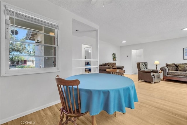 506 Geneva Ave, Claremont, CA 91711 - dining room featuring wood finished floors, a textured ceiling, and recessed lighting