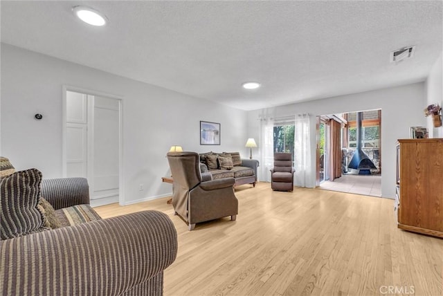 506 Geneva Ave, Claremont, CA 91711 - living area featuring light wood finished floors, a textured ceiling, and recessed lighting