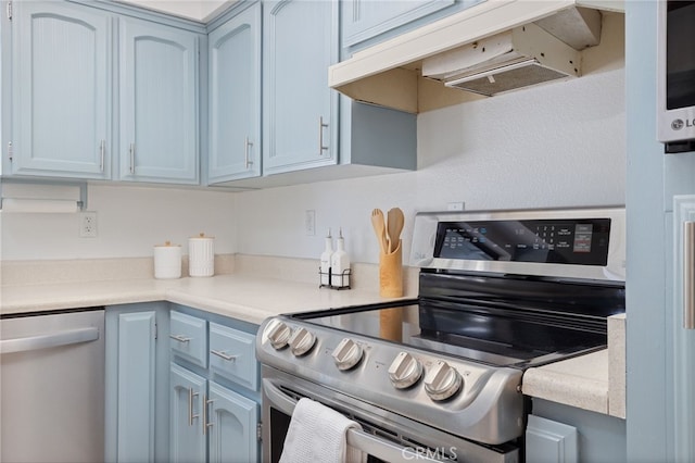 50128 Deer Meadow Way, Oakhurst, CA 93644 - kitchen with stainless steel appliances, extractor fan, light countertops, and blue cabinets