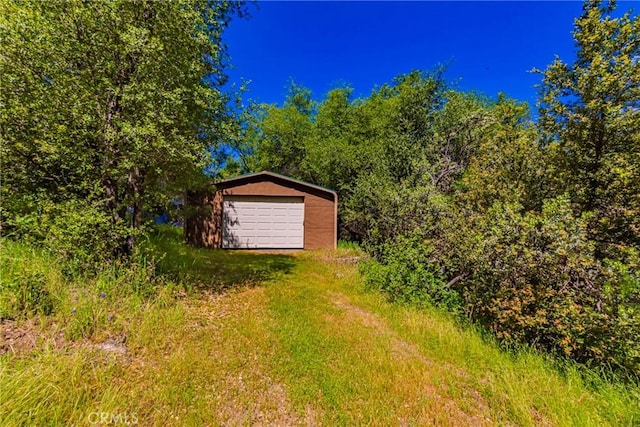 50128 Deer Meadow Way, Oakhurst, CA 93644 - view of yard with a garage and an outdoor structure