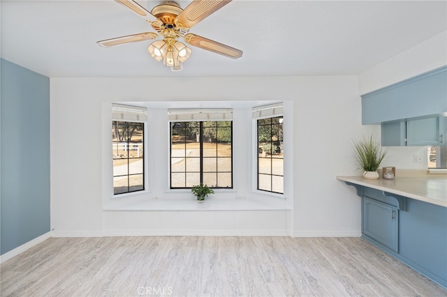 50128 Deer Meadow Way, Oakhurst, CA 93644 - unfurnished dining area featuring light wood-style flooring and a ceiling fan