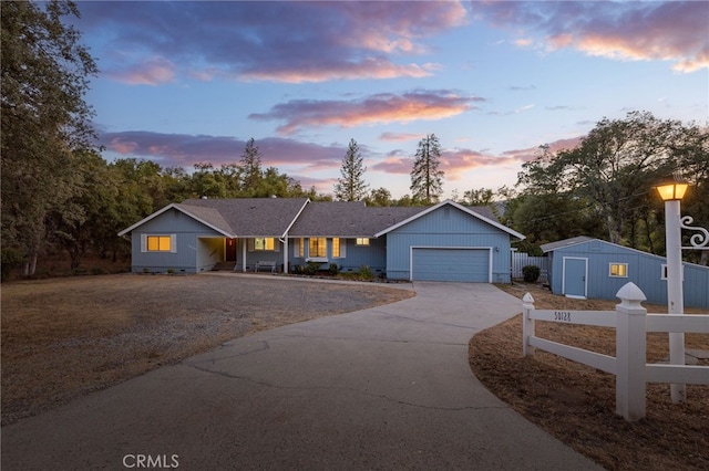 50128 Deer Meadow Way, Oakhurst, CA 93644 - ranch-style house with driveway, a garage, and a porch