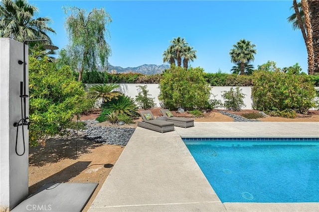 1525 Sonora Ct, Palm Springs, CA 92264 - view of swimming pool featuring a fenced backyard, a mountain view, and a patio area