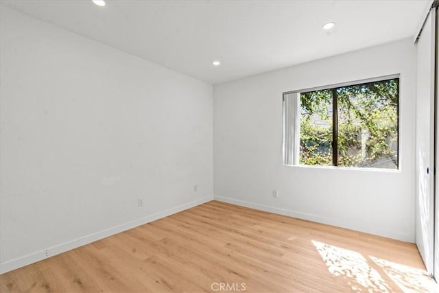 2 Brookstone, Irvine, CA 92604 - empty room with light wood-type flooring and recessed lighting