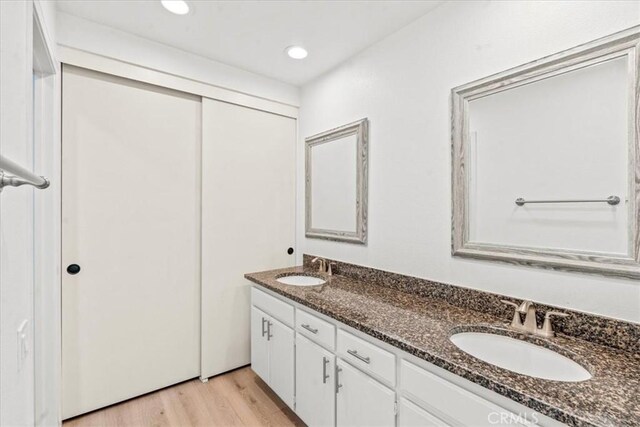 2 Brookstone, Irvine, CA 92604 - full bathroom featuring double vanity, wood finished floors, and recessed lighting