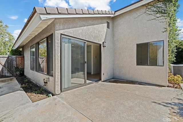 2 Brookstone, Irvine, CA 92604 - rear view of house with a patio and stucco siding