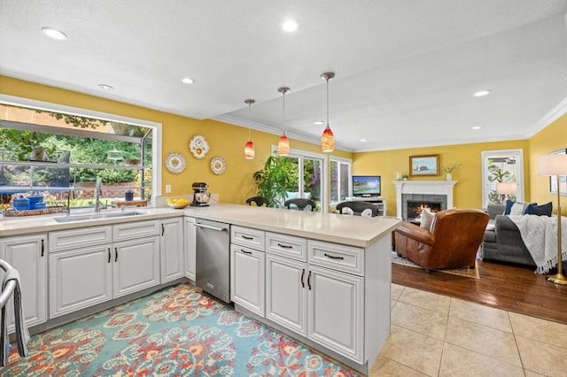 2702 Jacaranda Ave, Carlsbad, CA 92009 - kitchen with dishwasher, light countertops, healthy amount of natural light, light tile patterned floors, and crown molding