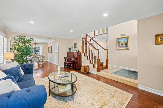 2702 Jacaranda Ave, Carlsbad, CA 92009 - living room featuring crown molding, hardwood / wood-style floors, stairs, recessed lighting, and arched walkways