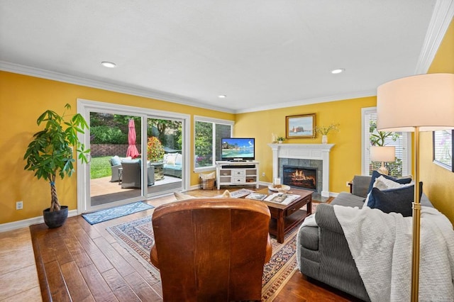 2702 Jacaranda Ave, Carlsbad, CA 92009 - living area featuring a tiled fireplace, wood-type flooring, ornamental molding, and recessed lighting