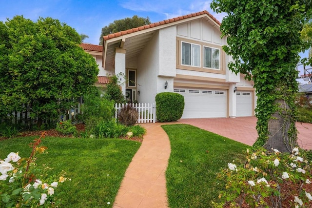 2702 Jacaranda Ave, Carlsbad, CA 92009 - view of front of house featuring a tiled roof, stucco siding, decorative driveway, and an attached garage