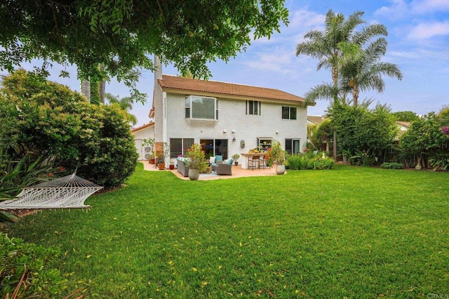 2702 Jacaranda Ave, Carlsbad, CA 92009 - rear view of property featuring a patio area, a lawn, stucco siding, and a chimney