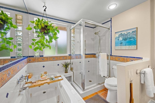 2702 Jacaranda Ave, Carlsbad, CA 92009 - bathroom with tile walls, a shower stall, and tile patterned flooring