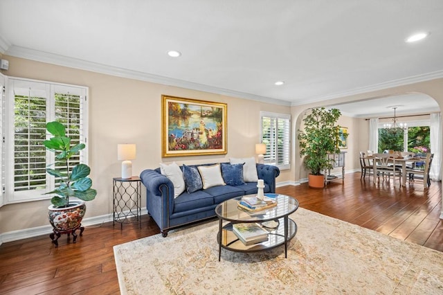 2702 Jacaranda Ave, Carlsbad, CA 92009 - living room with wood-type flooring, ornamental molding, a chandelier, recessed lighting, and arched walkways