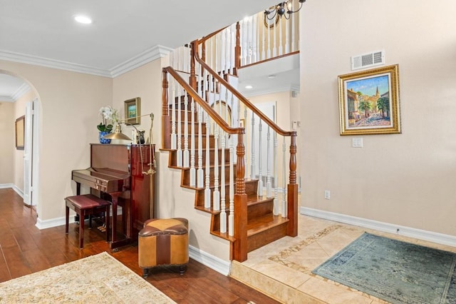 2702 Jacaranda Ave, Carlsbad, CA 92009 - stairs featuring arched walkways, ornamental molding, wood finished floors, and recessed lighting