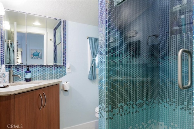 1939 Circle Dr, Cayucos, CA 93430 - bathroom with vanity, a stall shower, and decorative backsplash