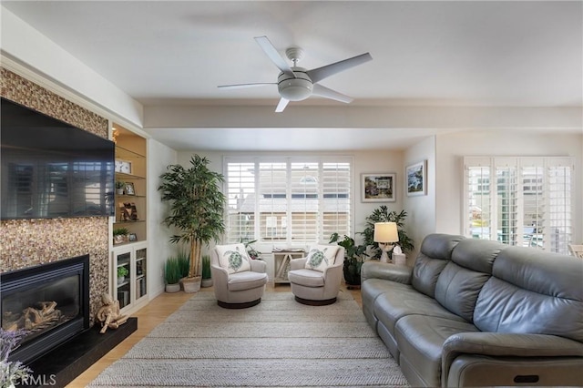 1939 Circle Dr, Cayucos, CA 93430 - living area with plenty of natural light, ceiling fan, a tile fireplace, and light wood-style floors