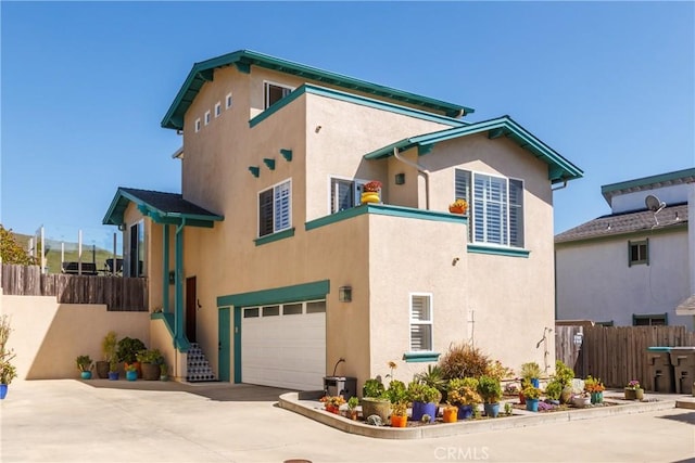 1939 Circle Dr, Cayucos, CA 93430 - back of house with a garage, stucco siding, and concrete driveway