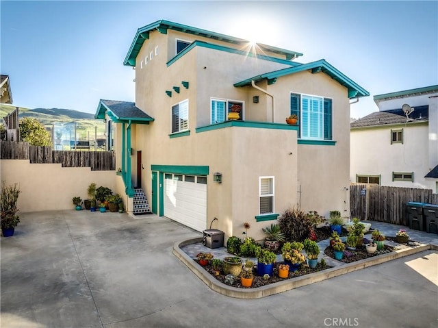 1939 Circle Dr, Cayucos, CA 93430 - view of front facade featuring a garage, stucco siding, and driveway