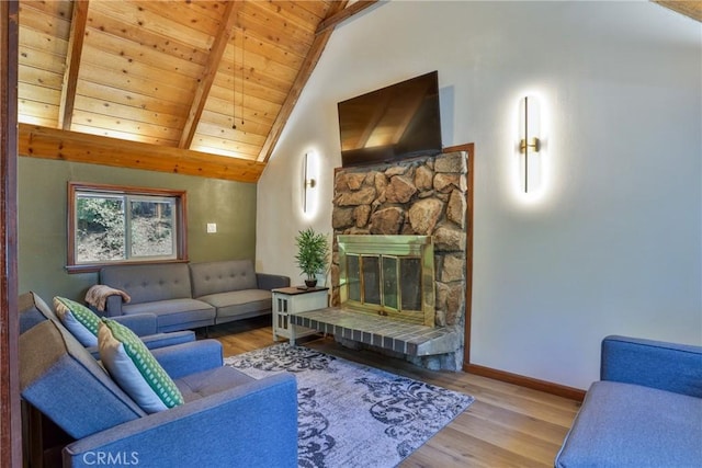 2548 Secret Dr, Running Springs, CA 92382 - living room featuring wood finished floors, wood ceiling, and a stone fireplace