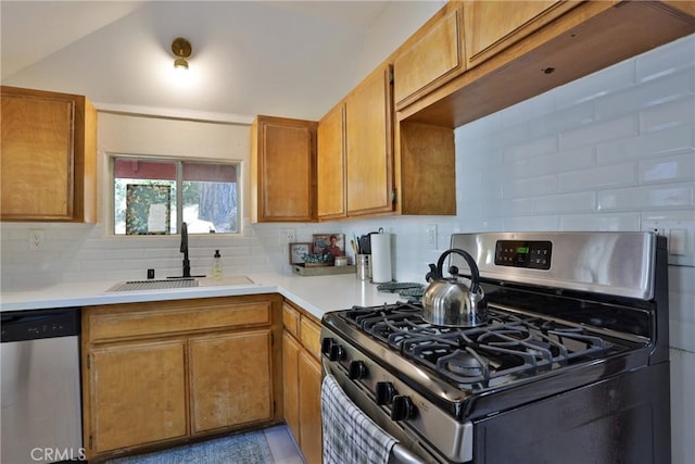 2548 Secret Dr, Running Springs, CA 92382 - kitchen with stainless steel appliances, light countertops, decorative backsplash, and brown cabinetry
