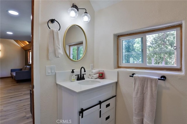 2548 Secret Dr, Running Springs, CA 92382 - bathroom with vaulted ceiling, vanity, wood finished floors, and recessed lighting