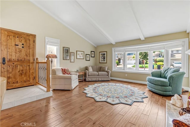 20002 Tomlee Ave, Torrance, CA 90503 - living area featuring wood finished floors, healthy amount of natural light, beamed ceiling, and high vaulted ceiling