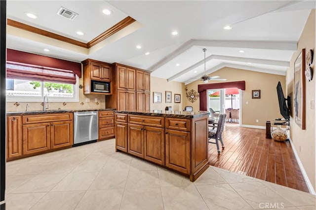 20002 Tomlee Ave, Torrance, CA 90503 - kitchen featuring stainless steel dishwasher, black microwave, brown cabinetry, plenty of natural light, and recessed lighting