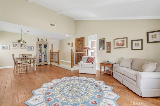 20002 Tomlee Ave, Torrance, CA 90503 - living area with beamed ceiling, light wood finished floors, and high vaulted ceiling