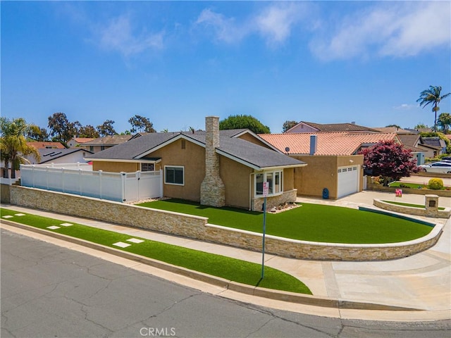 20002 Tomlee Ave, Torrance, CA 90503 - ranch-style house with stucco siding, driveway, and a garage