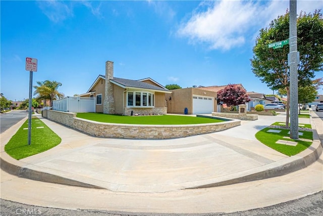 20002 Tomlee Ave, Torrance, CA 90503 - single story home featuring stucco siding, stone siding, concrete driveway, a garage, and a chimney